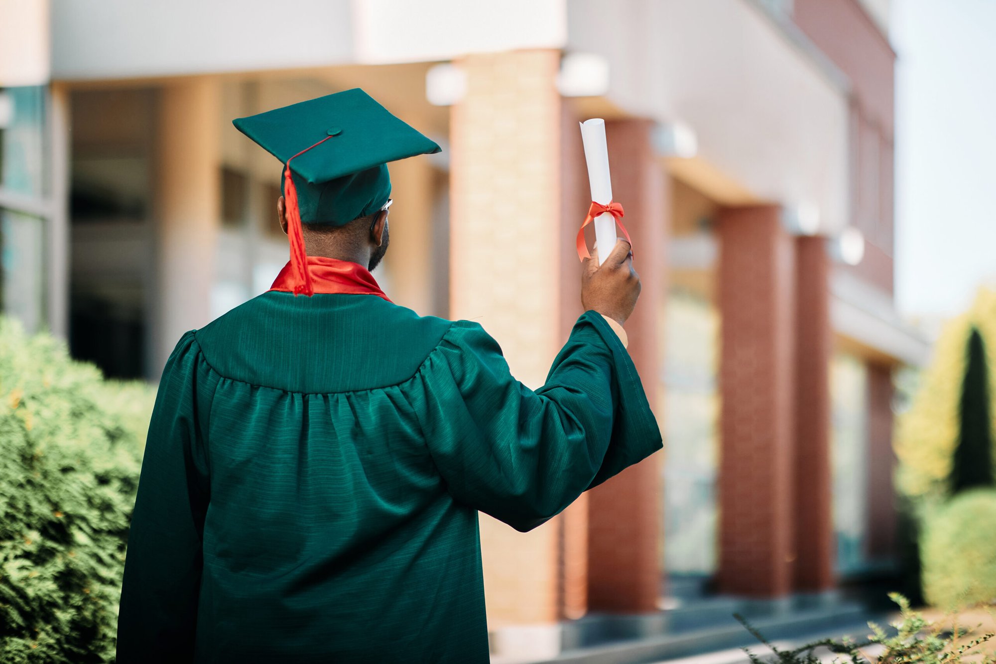 rear-view-of-black-graduate-student-with-college-d-2023-02-02-19-17-03-utc-scaled rear-view-of-black-graduate-student-with-college-d-2023-02-02-19-17-03-utc-scaled